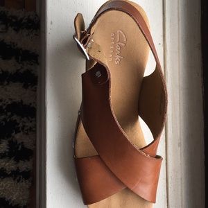 Clark’s tan platform sandals.